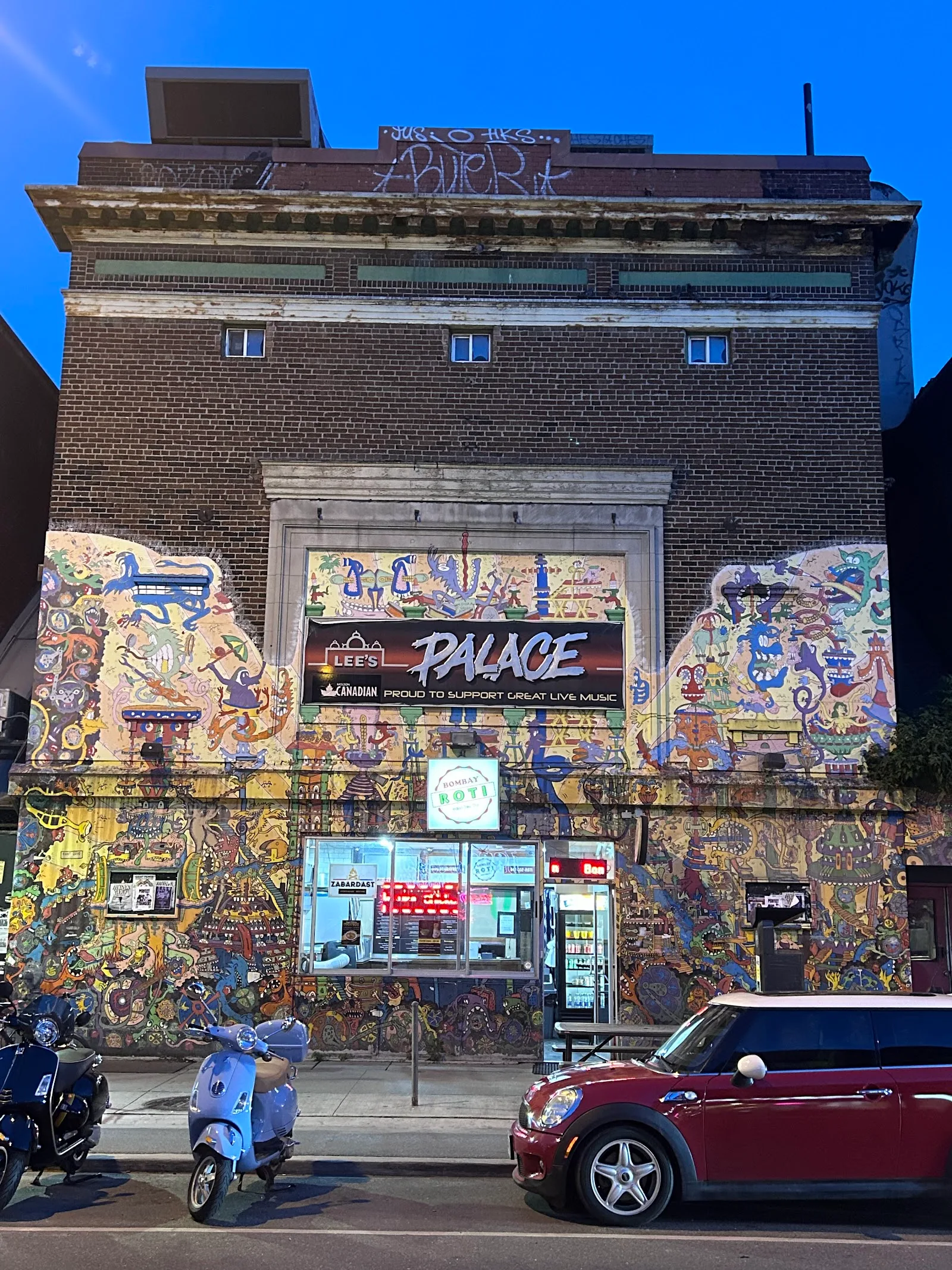 Lee's Palace at 529 Bloor Street West in Toronto's Annex neighbourhood — a brick concert venue with its signature painted mural facade and PALACE marquee, an NXNE 2026 host venue