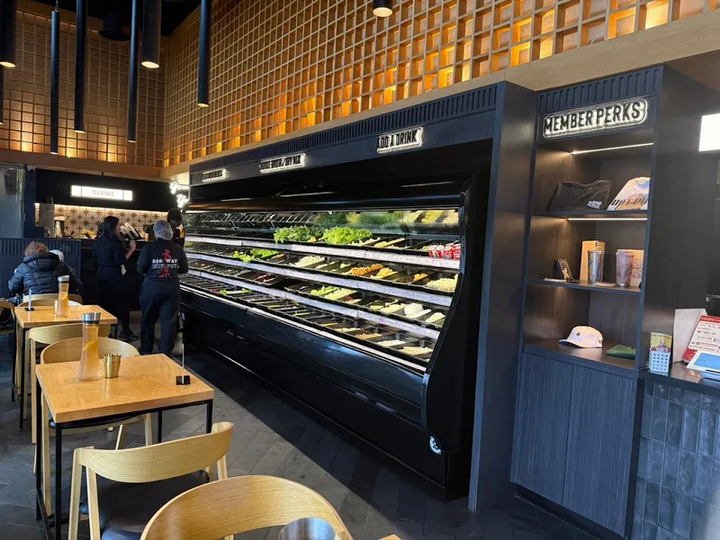 Big Way Hot Pot interior showing self-serve ingredient display and seating area