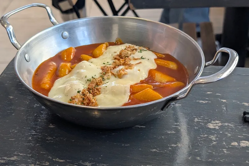 Woojoo Bunsik rose tteokbokki in a steel pan