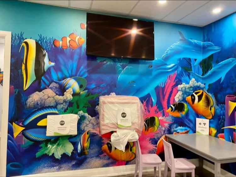 Appletree Dental for Kids underwater-themed treatment room with colorful ocean mural in Willowdale
