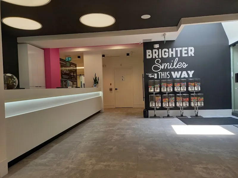 Brite Bite Kids Dental reception area with prize machines and Brighter Smiles This Way wall sign