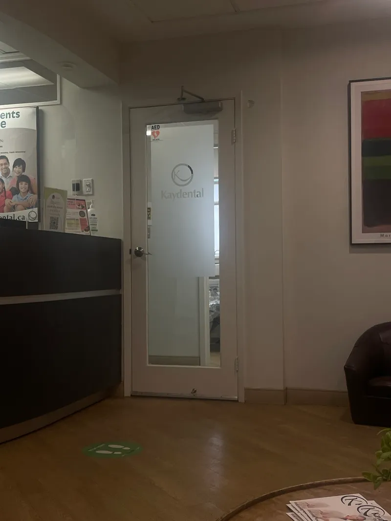 Kay Dental office interior showing reception area and frosted glass door with logo near Bessarion station