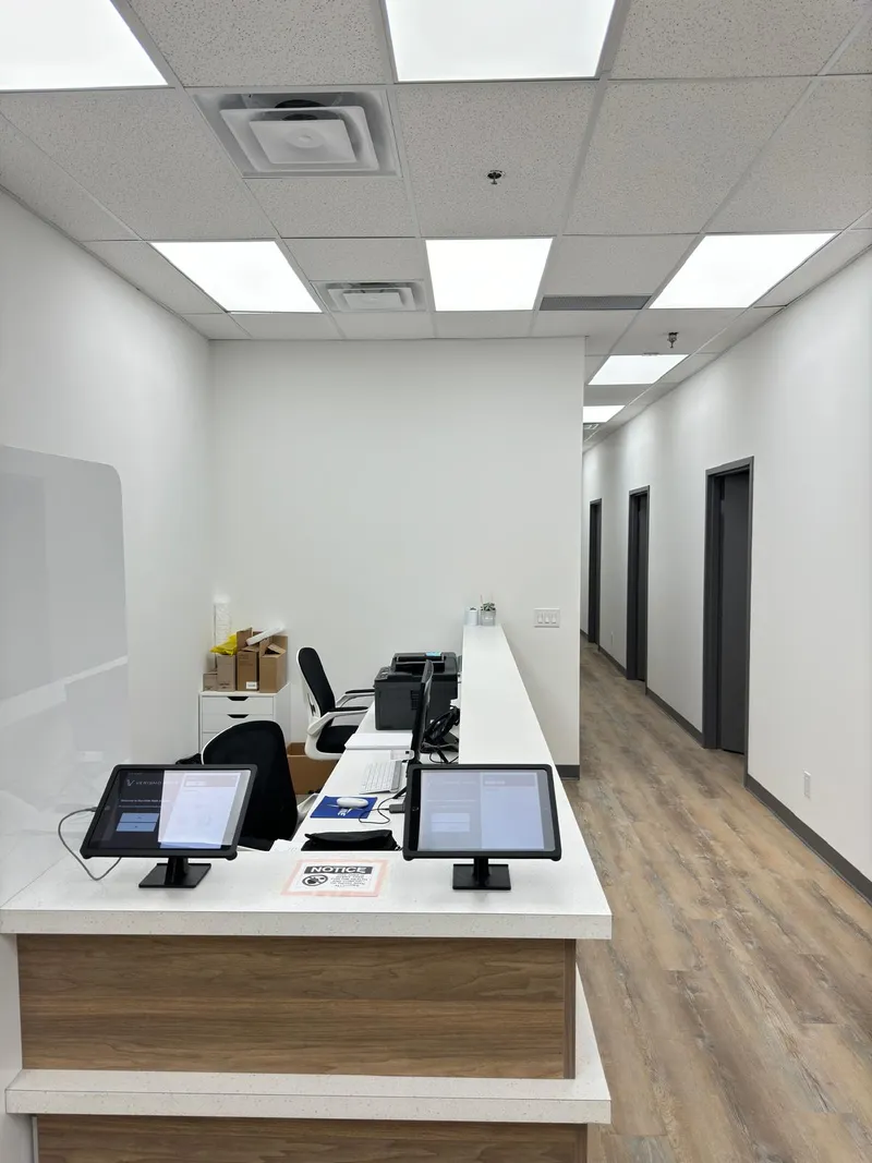 Don Mills Walk-In Clinic reception desk with digital check-in tablets at 1262 Don Mills Road in North York