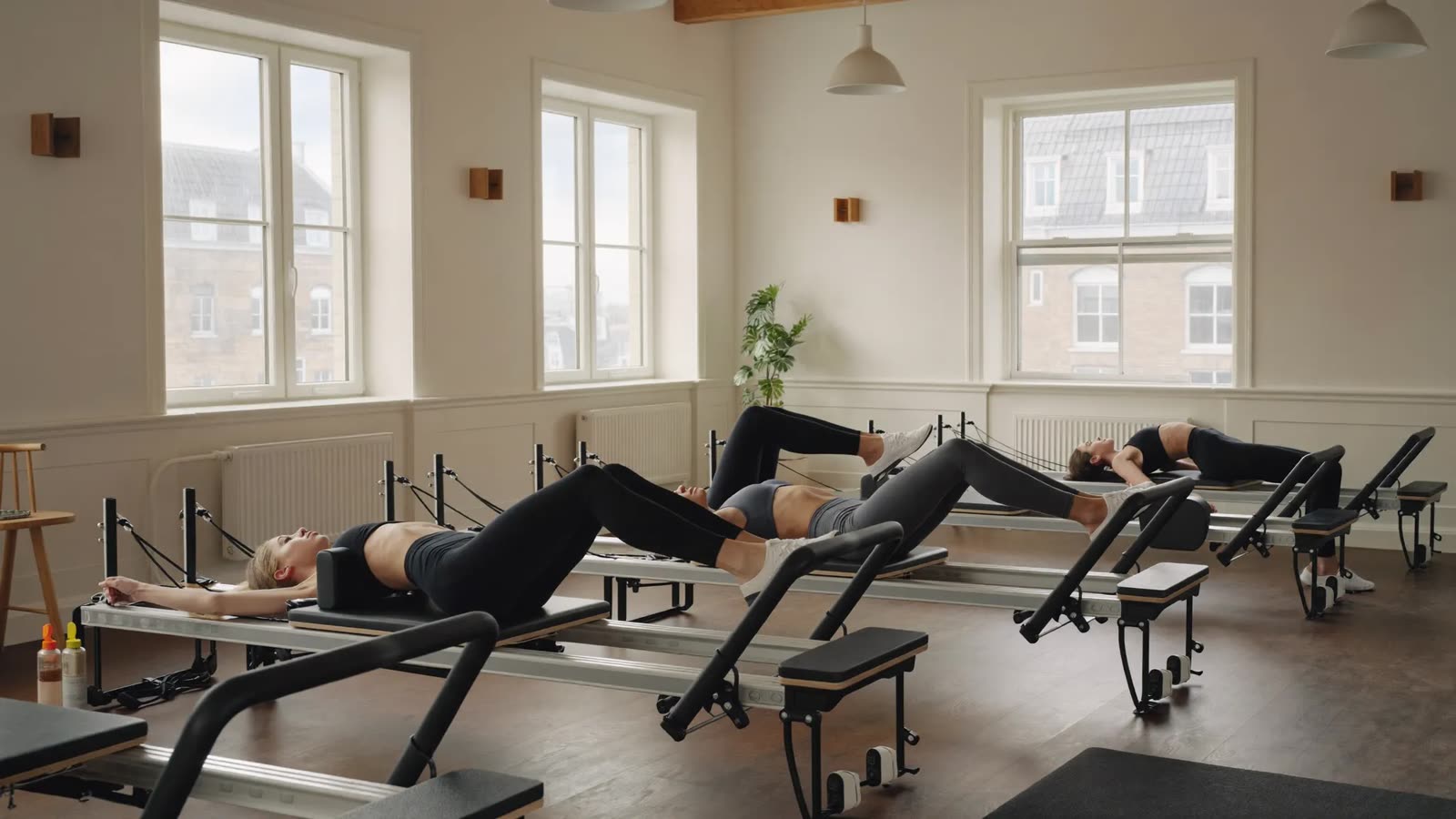 Reformer Pilates class in a bright North York studio