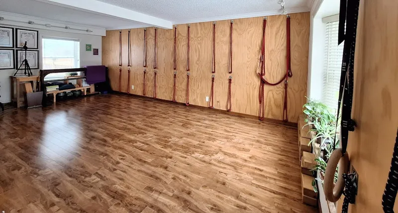 YogAnanta Studio interior with props and wooden floors